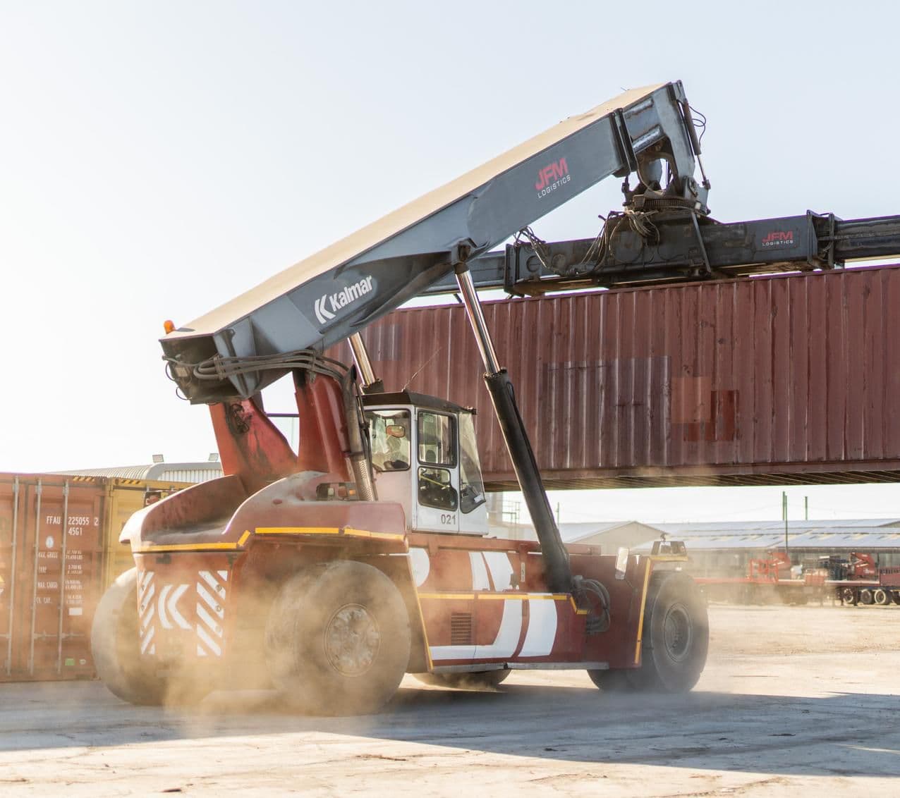 Reach stacker lifting a container