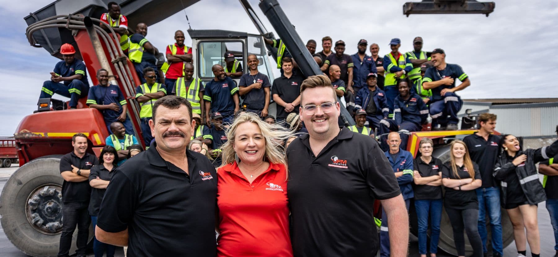 The whole JFM team on a reach stacker