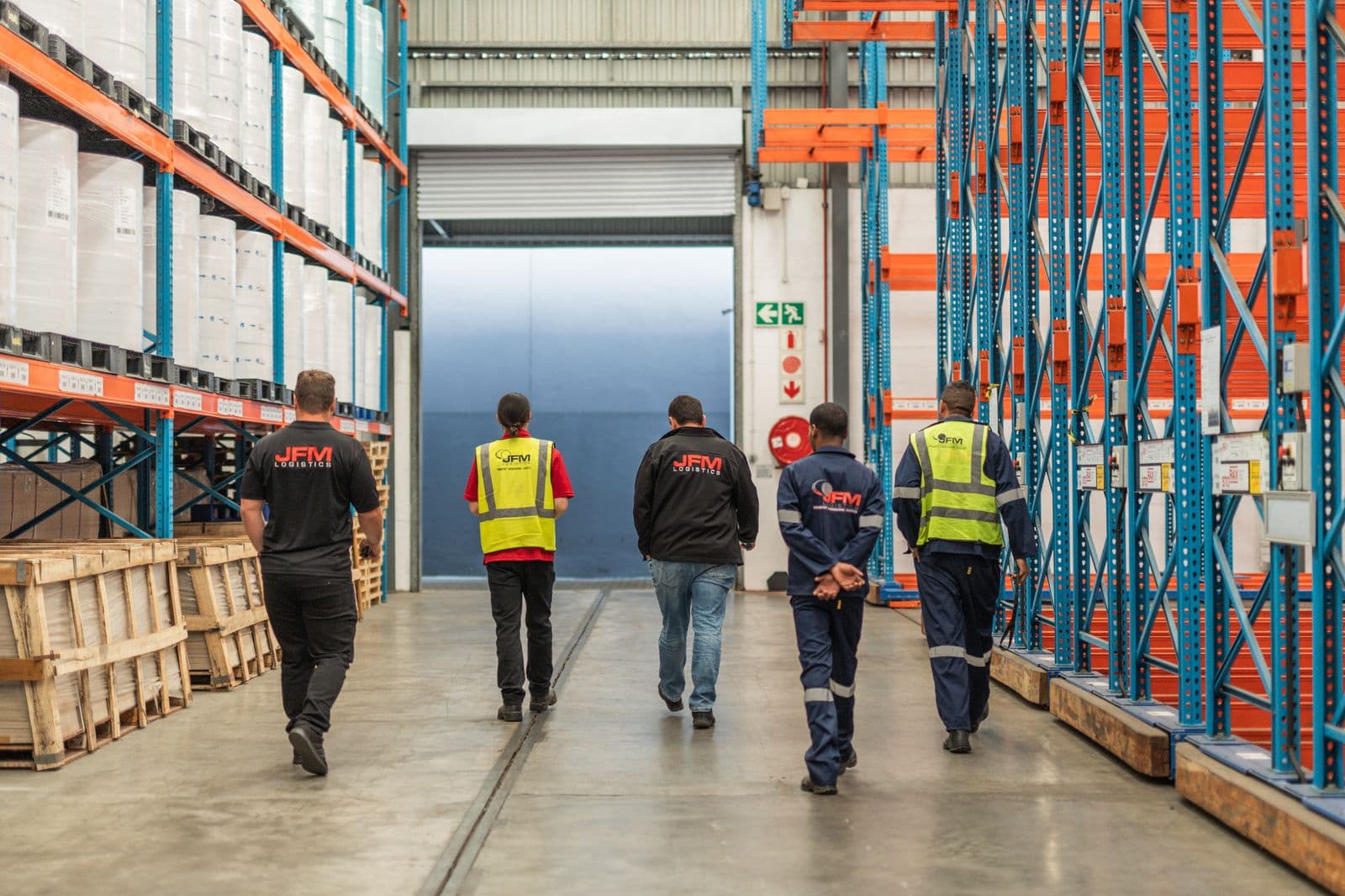 The team walking the warehouse floor
