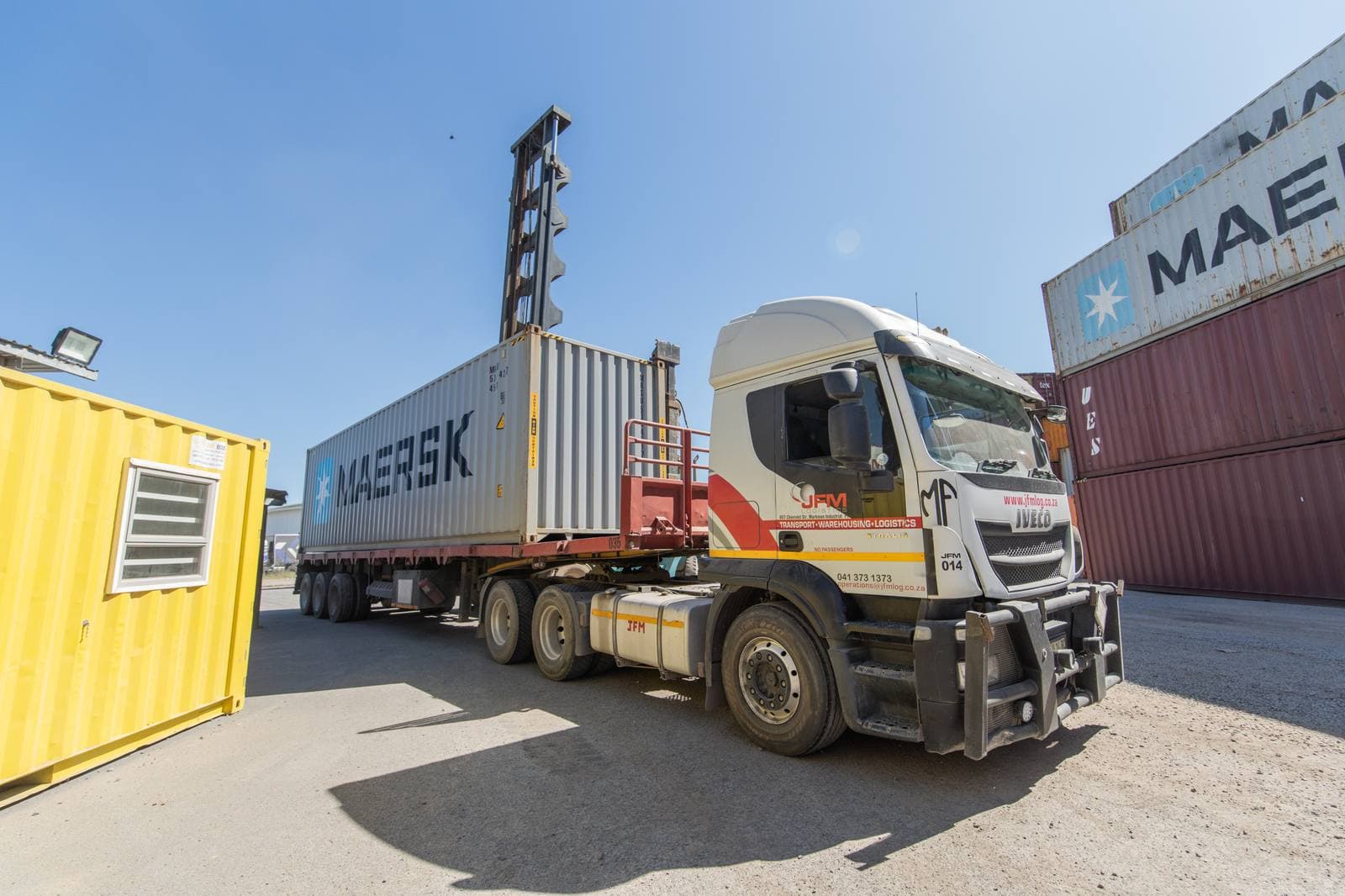 JFM truck loaded with a Maersk container
