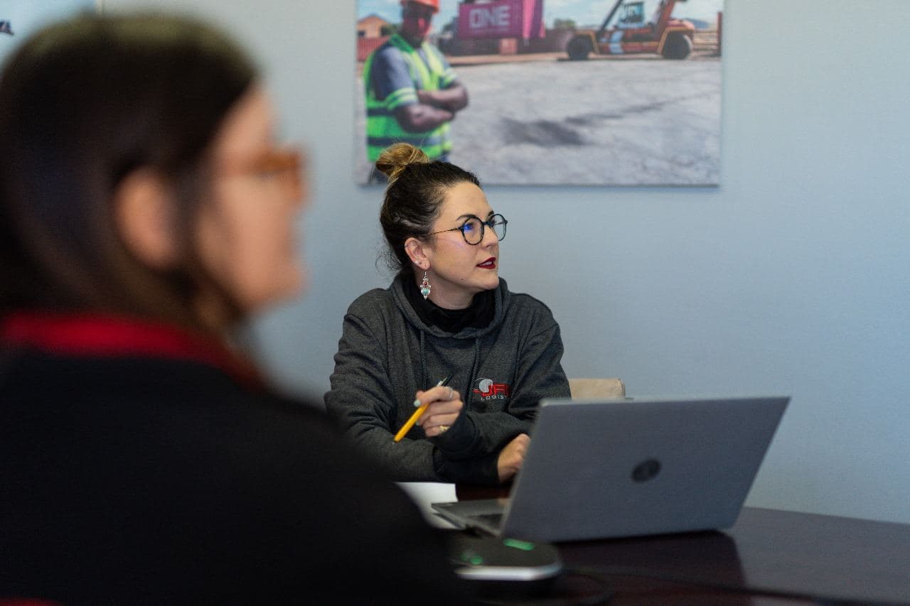 The JFM team at work in the office